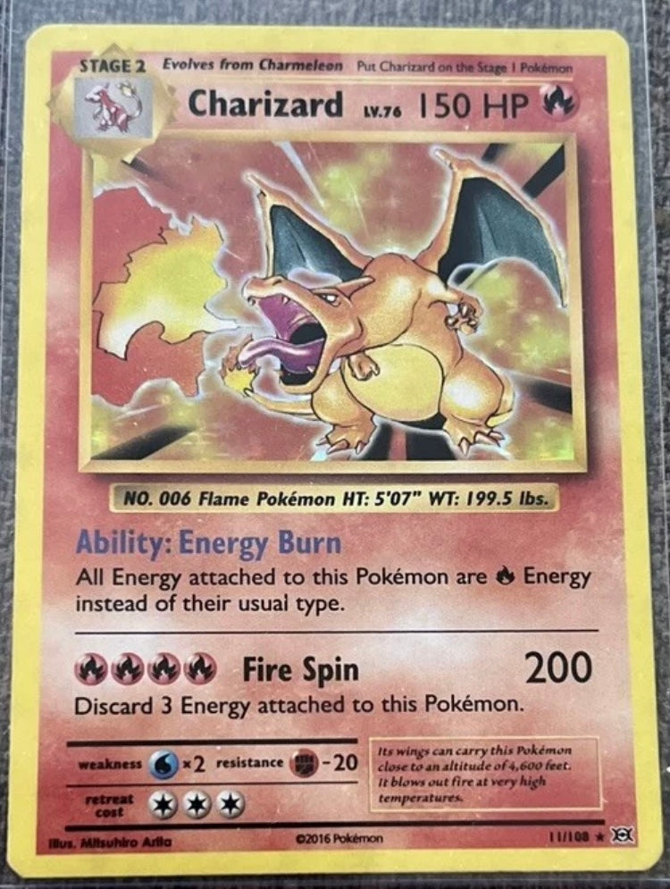 Charizard Pokémon TCG XY Evolutions 11/108 Holo Rare 2016 Edition Authentic 

Has some light scratches and light perimeter wear, card is clean, no stains or creases.