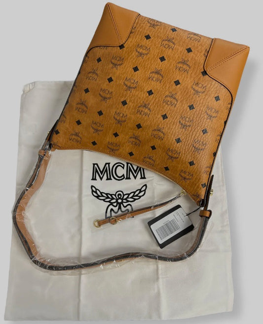 MCM Women's Brown Klara Monogram Medium Visetos Leather Shoulder Hand Hobo Bag

SIZE
10"W x 11.5"H x 4"D

Description
Signature monogram logo and tassel trim enhances this chic hobo bag.
Adjustable crossbody strap
Top zip
Tassel trim
24K gold hardware
1 i